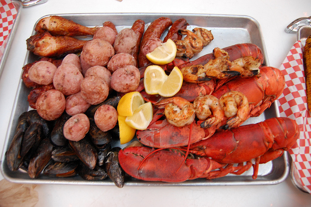 Grilled Maine lobster and Old Bay BBQ shrimp; smoked mussels, clams, buttermilk-brined chicken, Mikeska sausage and summer salt new potatoes. (WBEZ/Louisa Chu)