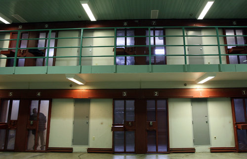 An inmate looks out from his cell at Tamms supermax prison in 2009. A typical pod consists of six wings with 10 cells in each wing, with each cell housing only one inmate. The facility closed in January 2013. (John Smierciak/Chicago Tribune/MCT/Landov)