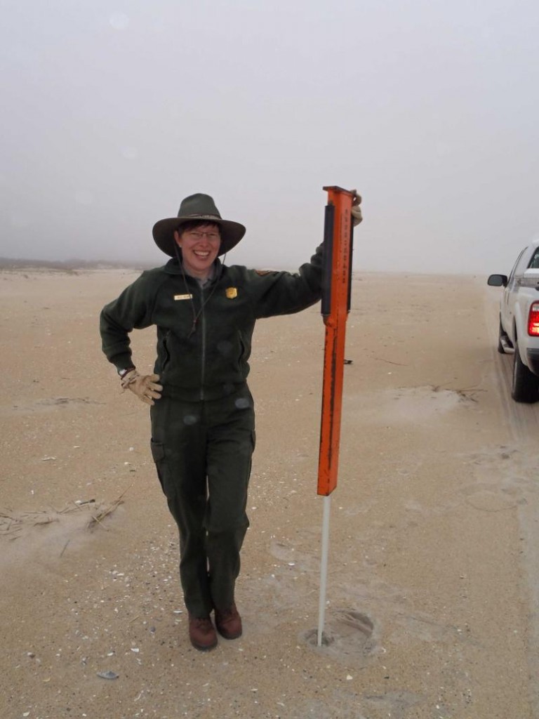 Assateague Island National Seashore 2013, Taylor pausing to show off my handy work after putting in fiberglass posts.