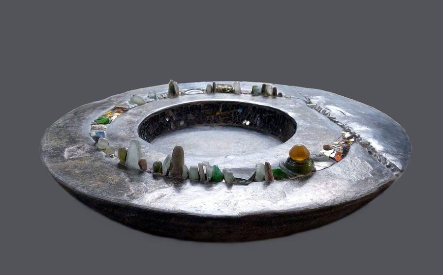 Ground bird bath Concrete, slate, pebbles and glass.
