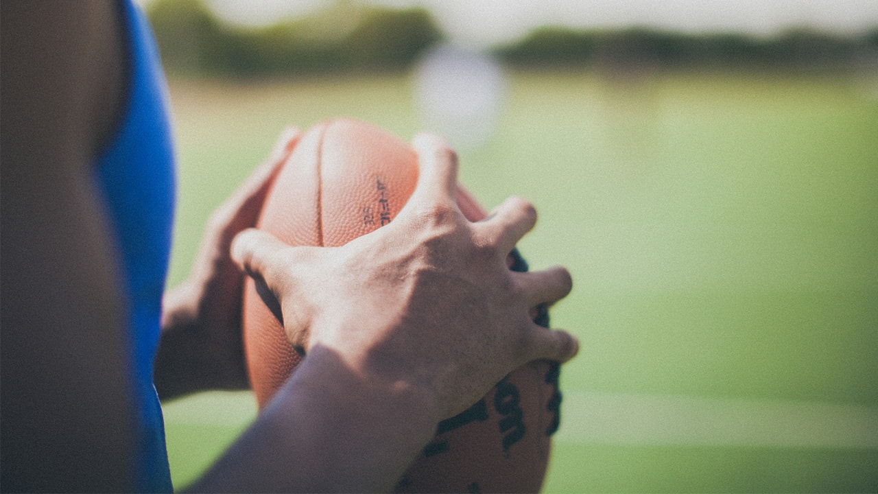 Athlete holding football