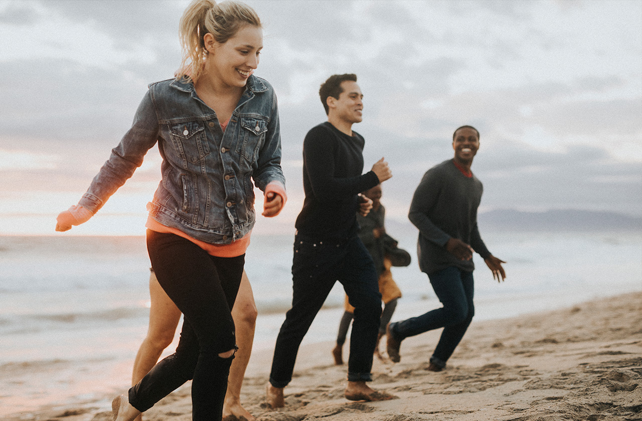 People running on a beach