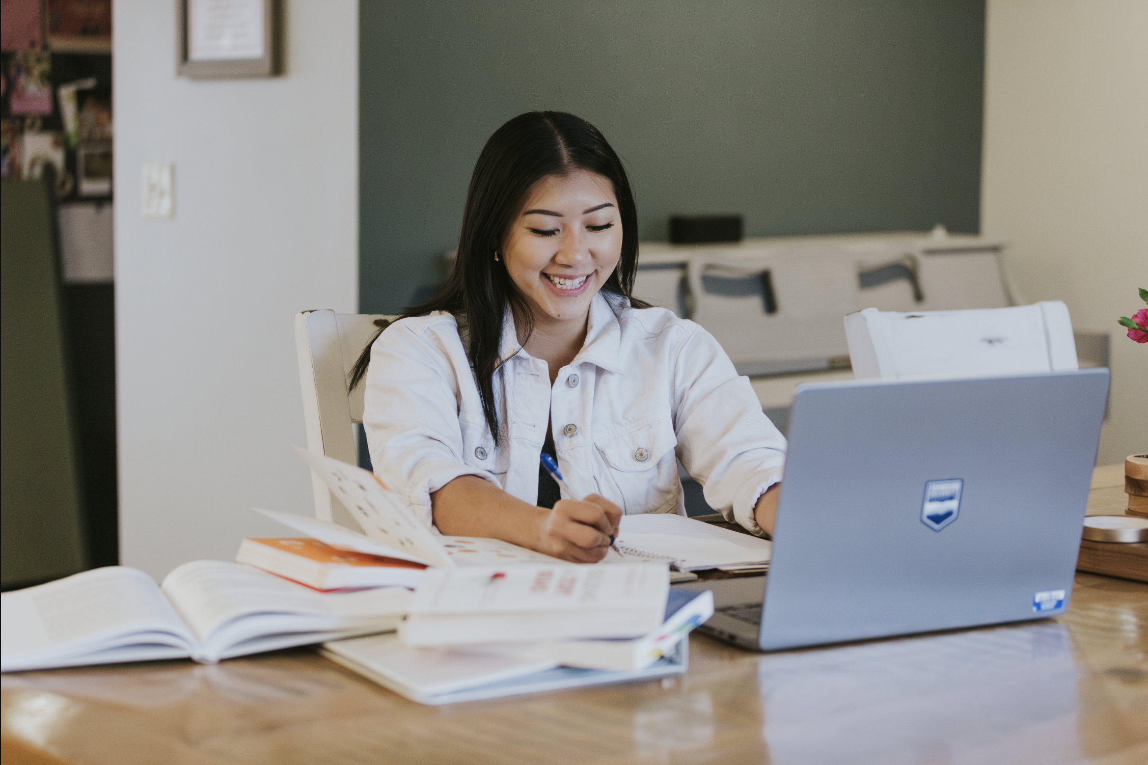 Graduate student completing coursework online