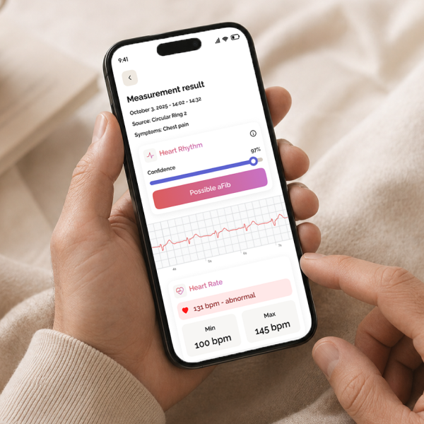 Circular app showing an ECG measurement result, held in one hand