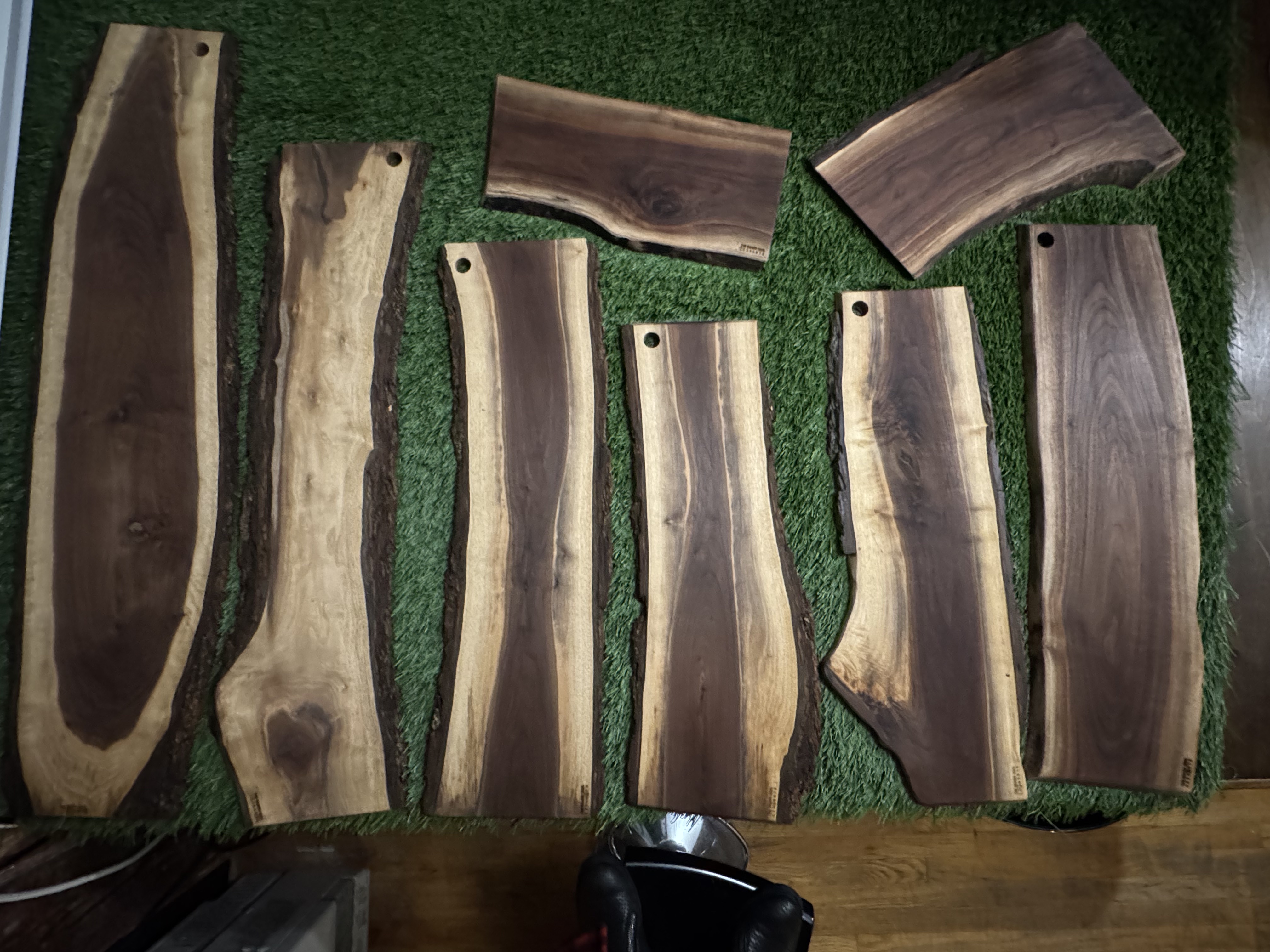 A batch of black walnut boards laid out before finishing