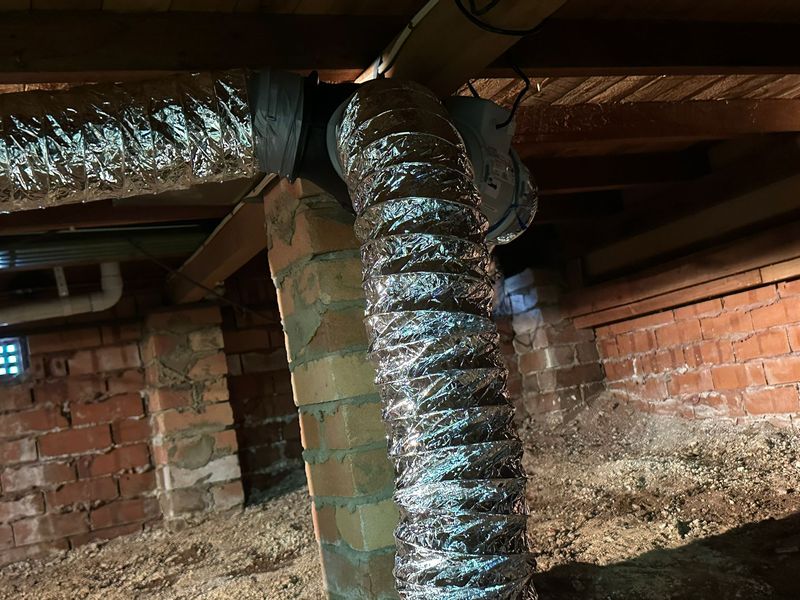 Neat subfloor ventilation ductwork under a home