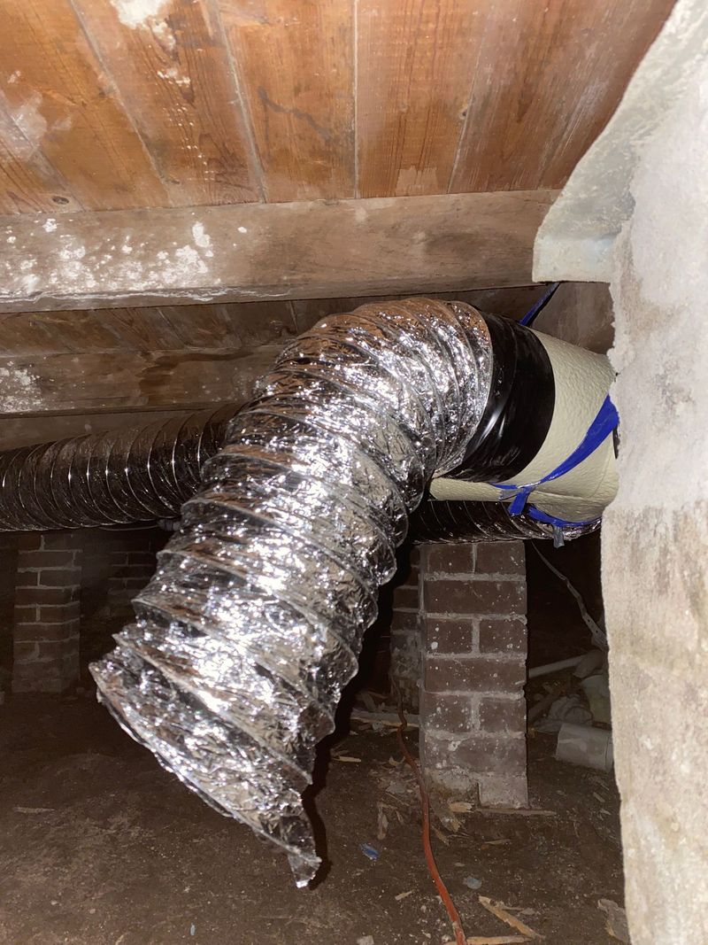 Mixed-flow subfloor fan mounted on a brick pier
