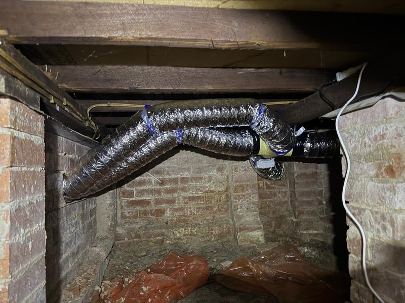 Fresh-air intake vent installed in a subfloor