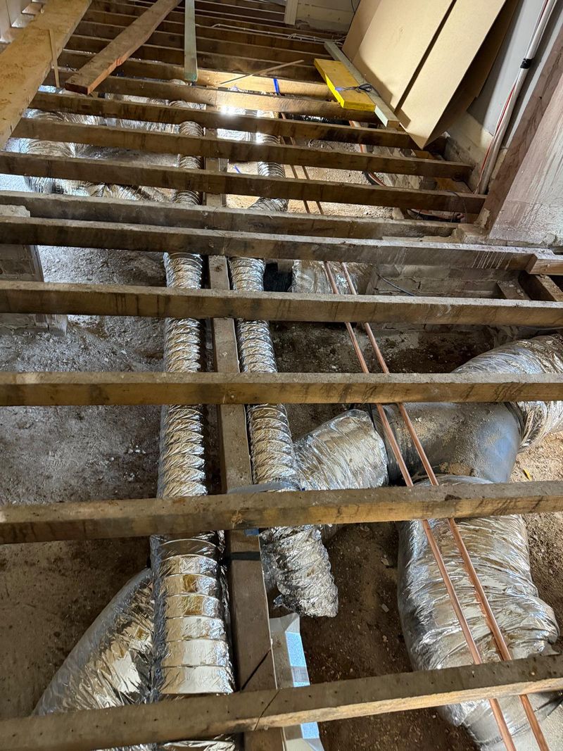 Underfloor ventilation ducting run across a subfloor