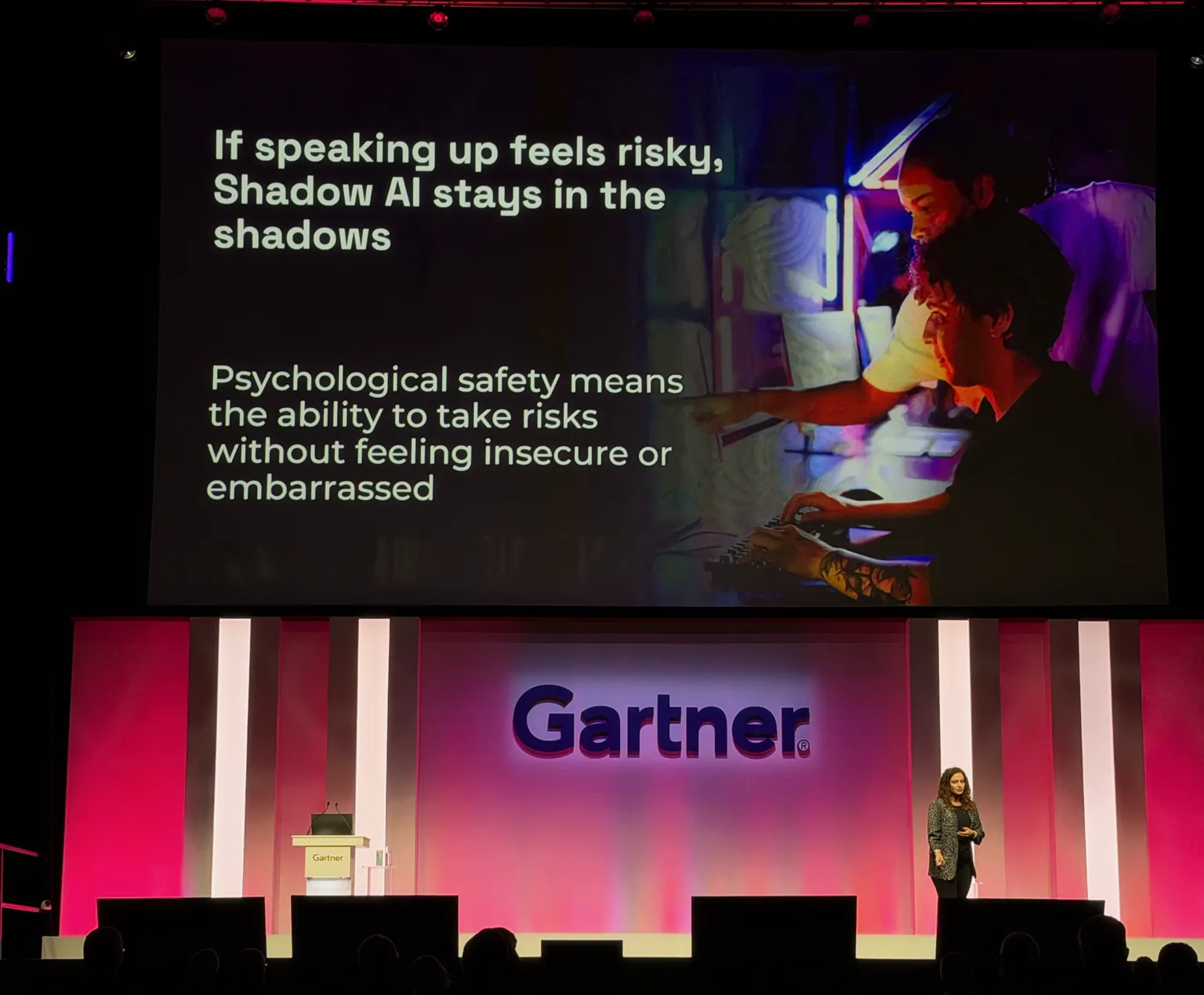 Noora Ahmed-Moshe on stage at the Gartner Security & Risk Management Summit in London, under her slide "If speaking up feels risky, Shadow AI stays in the shadows"