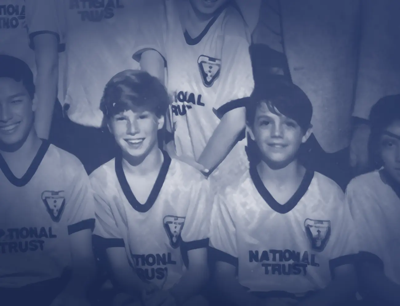 Skai and Joe as kids in matching team jerseys