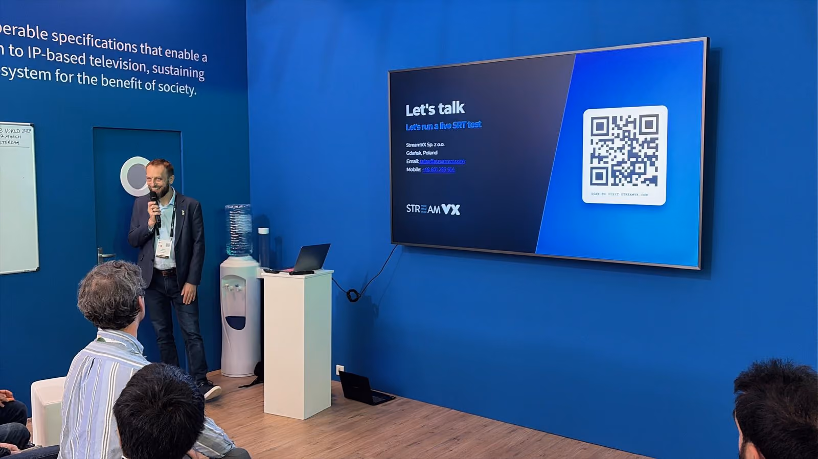 Szymon Karbowski speaking at the DVB Stand, IBC 2026