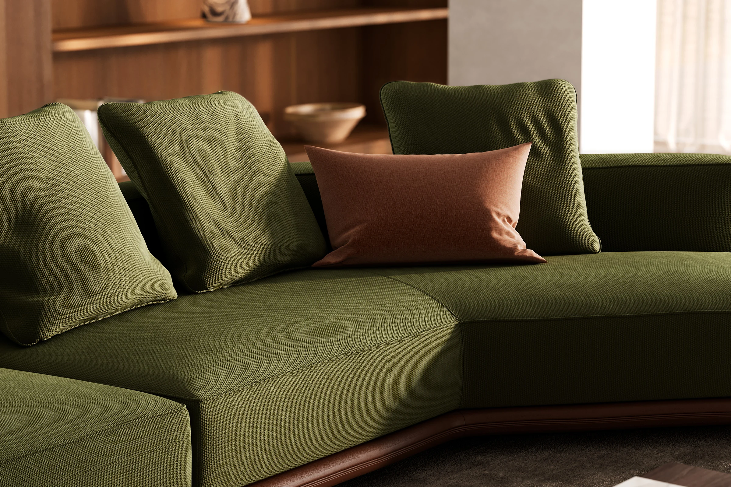 The same sofa from the same angle, in an olive-colored fabric finish