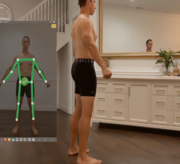 SNAP scanning demo: a male participant turning alongside a pose-tracking display