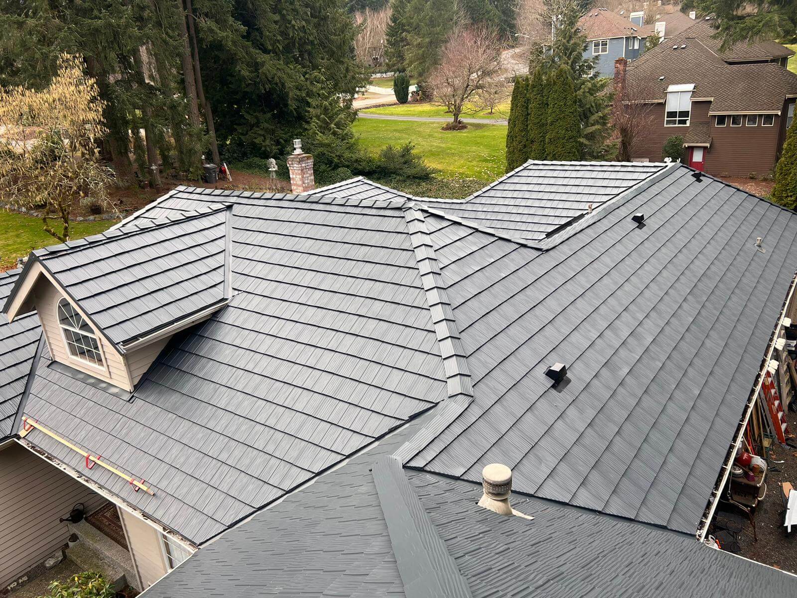 PermaLock aluminum shingle roof installed by ShieldPro, styled like shake shingles