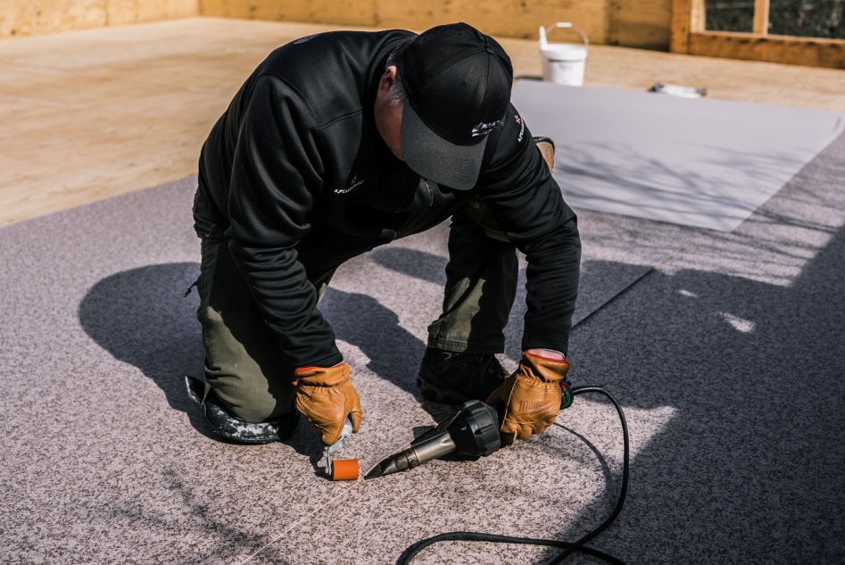 ShieldPro crew installing a flat, low-slope membrane roof