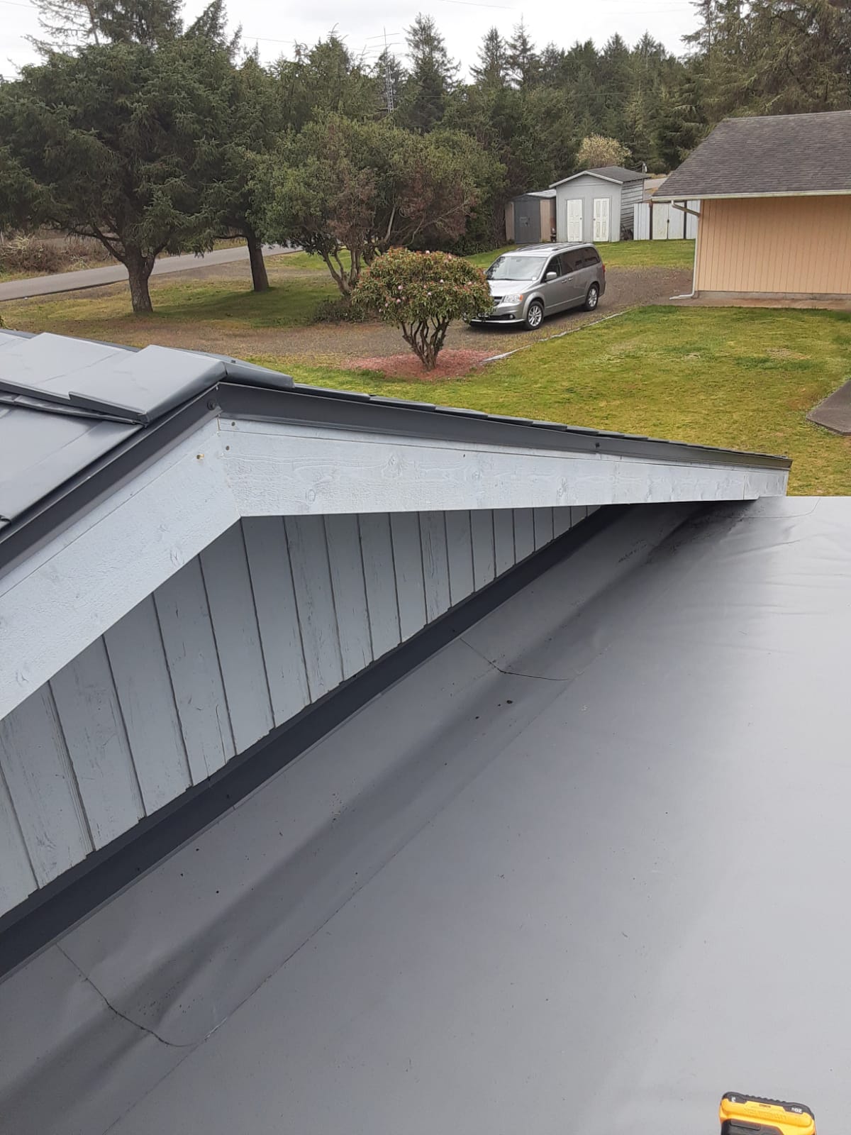 Real standing-seam metal roof panels installed by ShieldPro