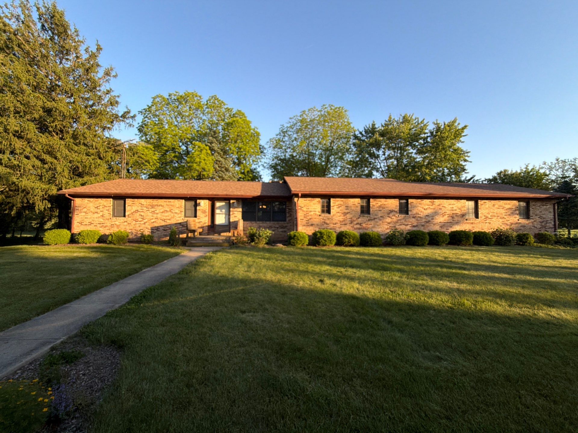 Wide view of the Dublin property and lawn before wind storm repairs