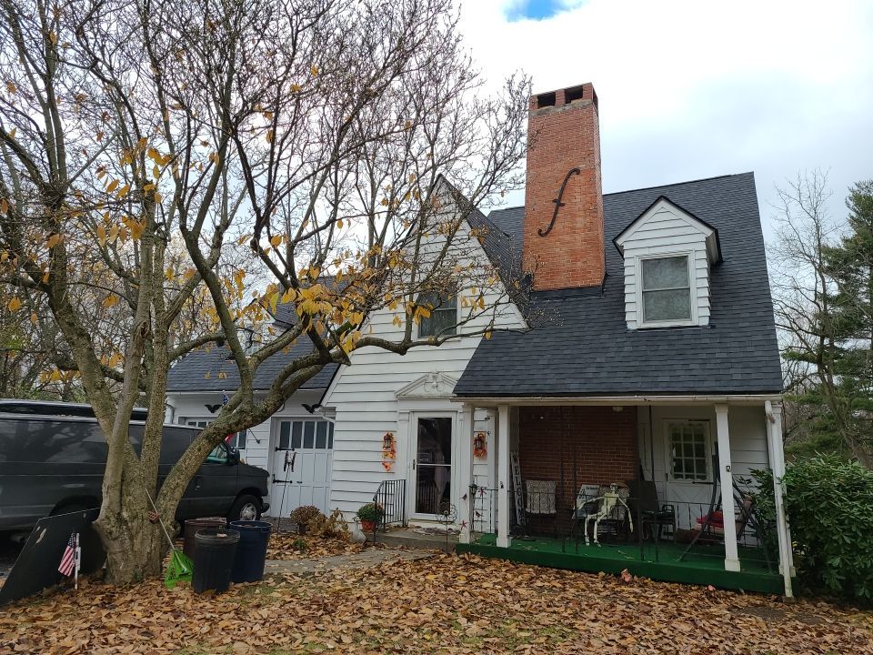 Home exterior before siding transformation from front angle