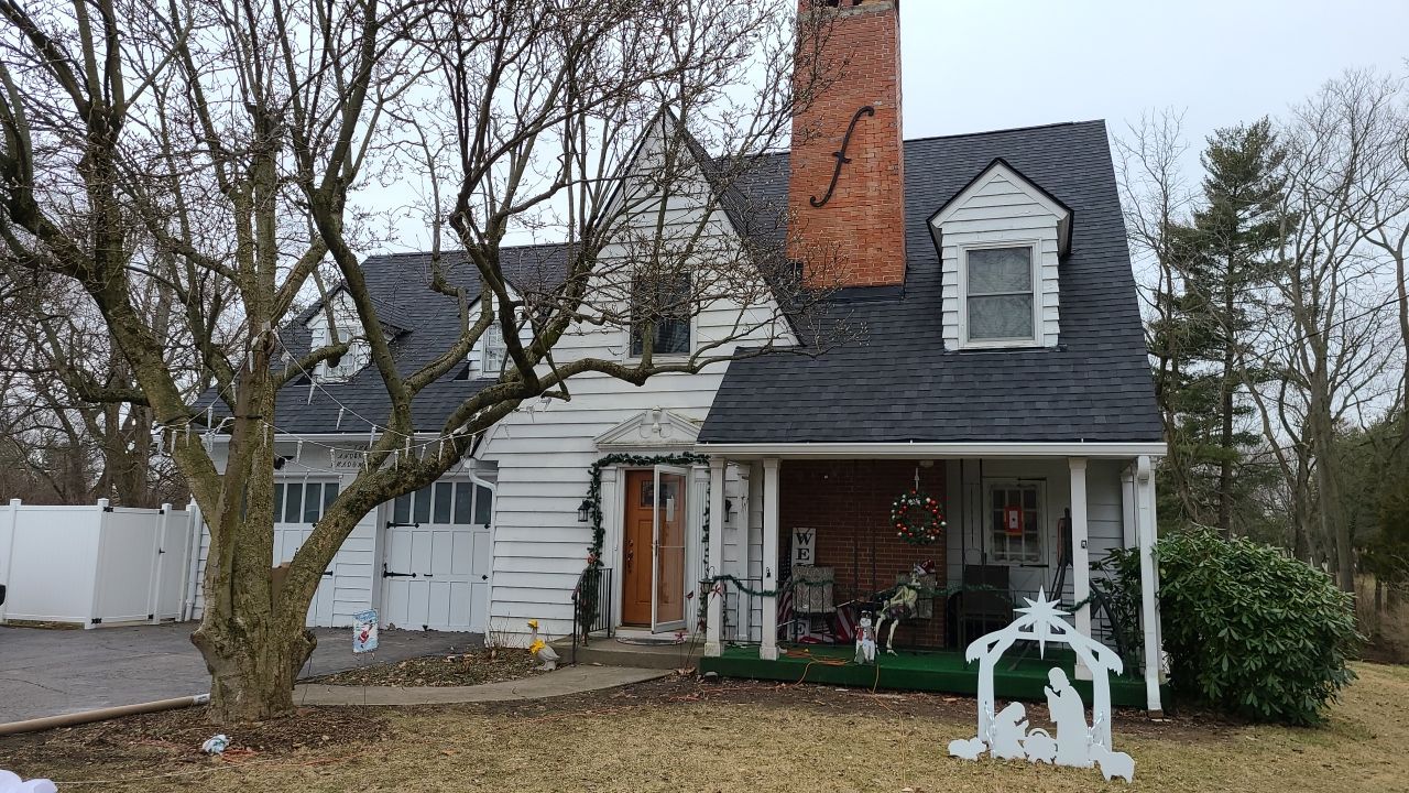 Central Ohio home before dark blue siding project by 614 Exteriors