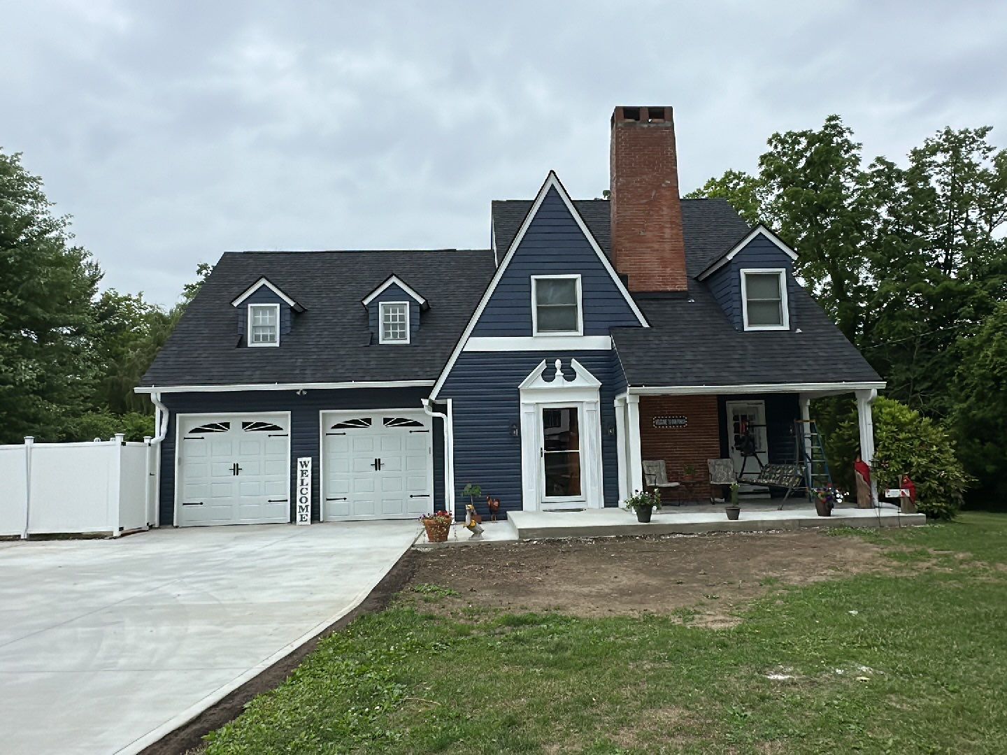Finished dark blue siding exterior by 614 Exteriors
