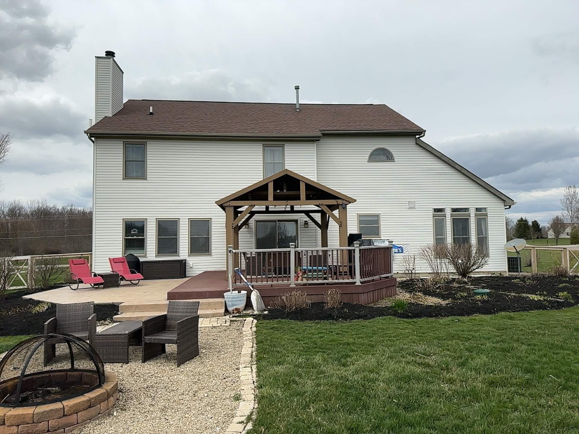 Rear of the two-story home before exterior renovation