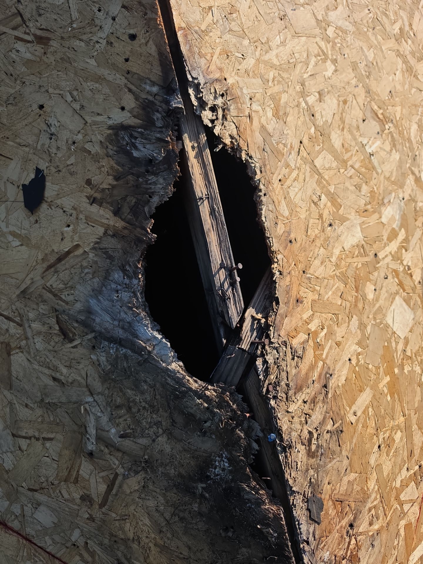 Damaged roof decking exposed during the Ohio Heart Group roof replacement