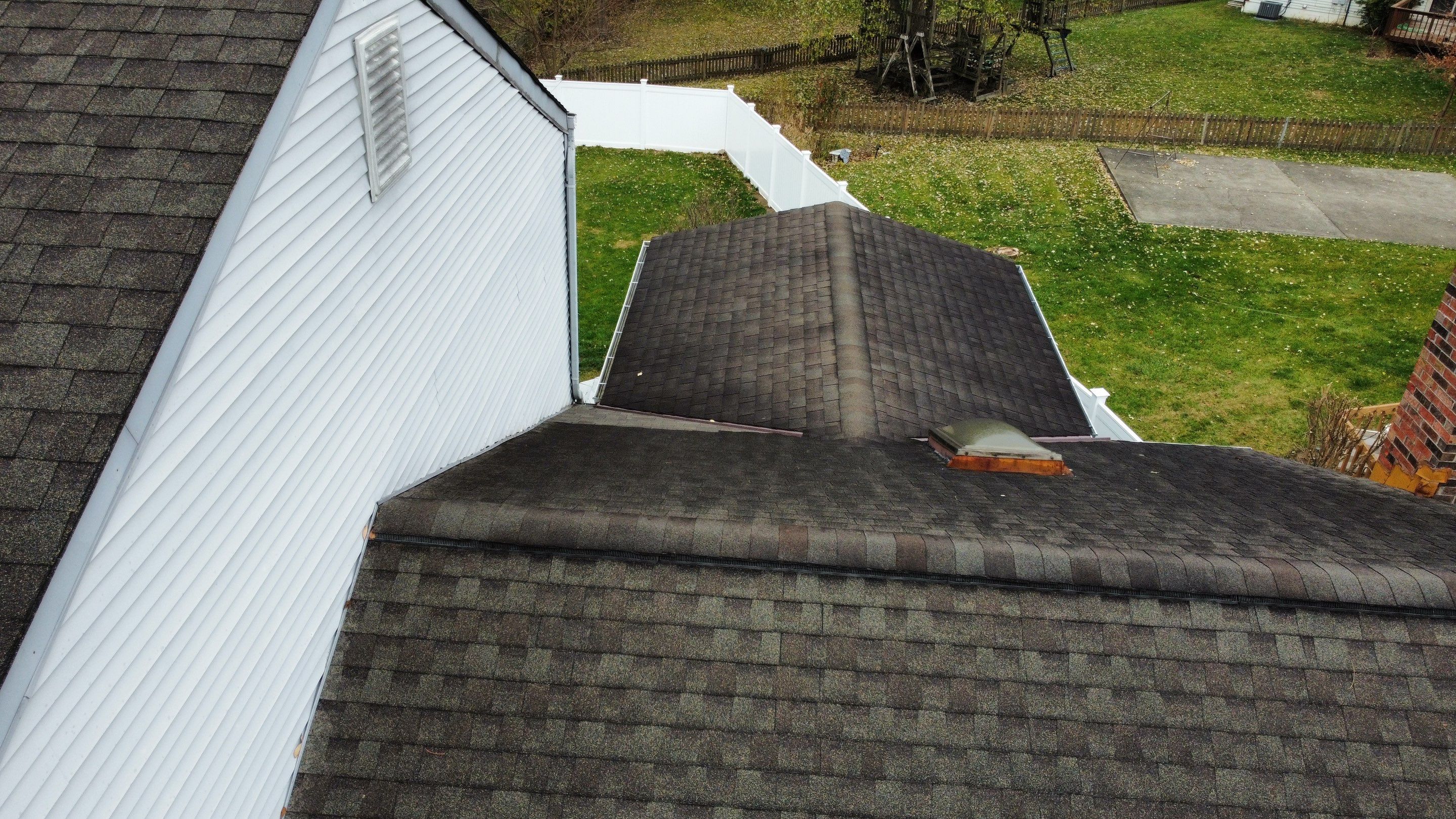 Close-up of the older roof shingles before replacement