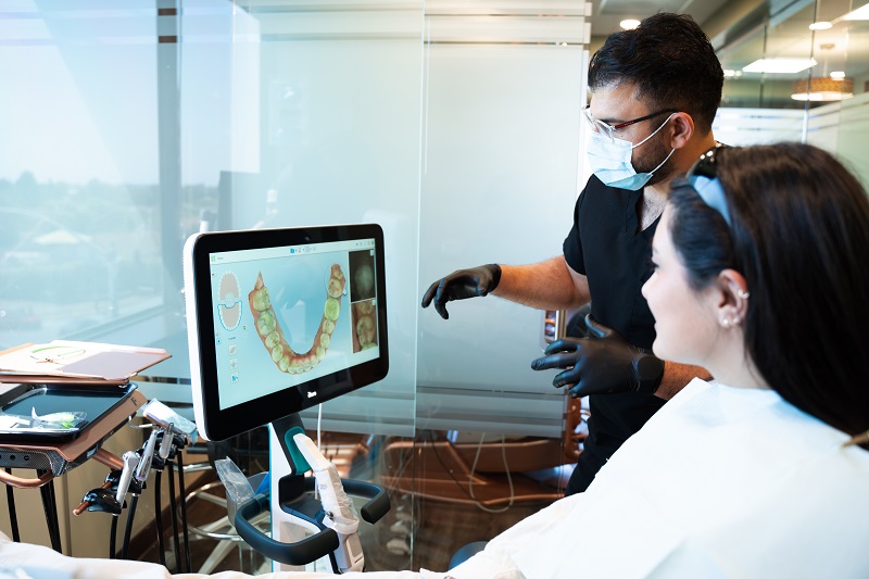 Dr. Raufy explaining a digital dental scan to a patient