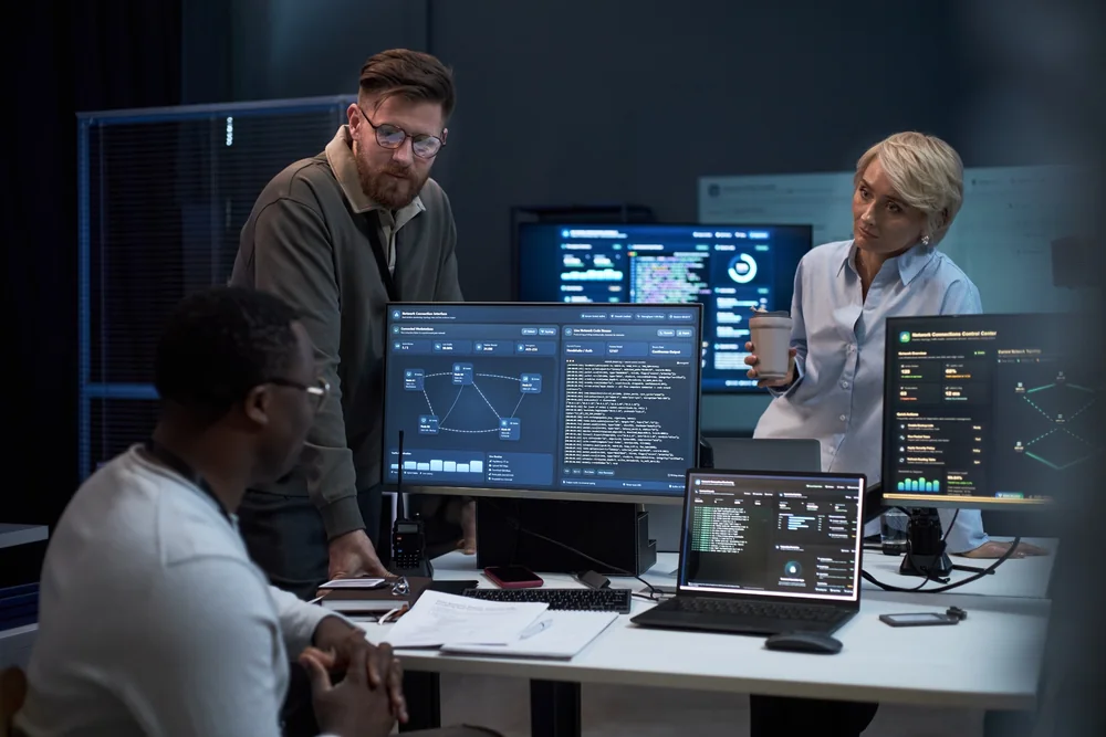 Cyber security professionals monitoring security alerts and systems