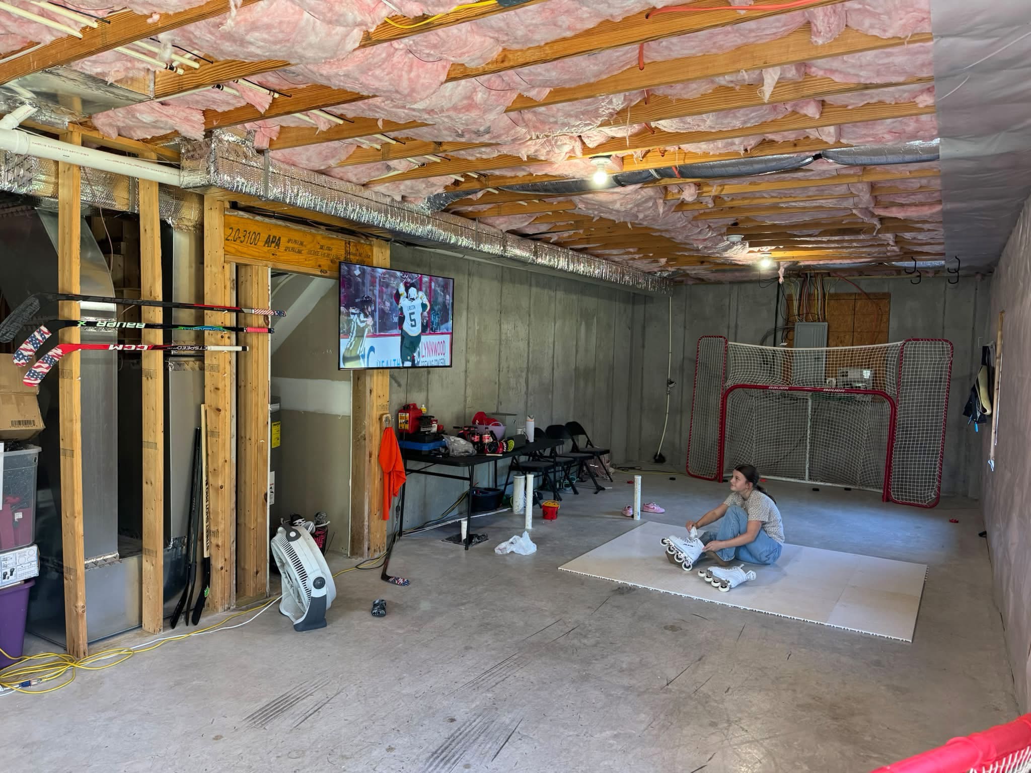 Unfinished basement hockey training setup