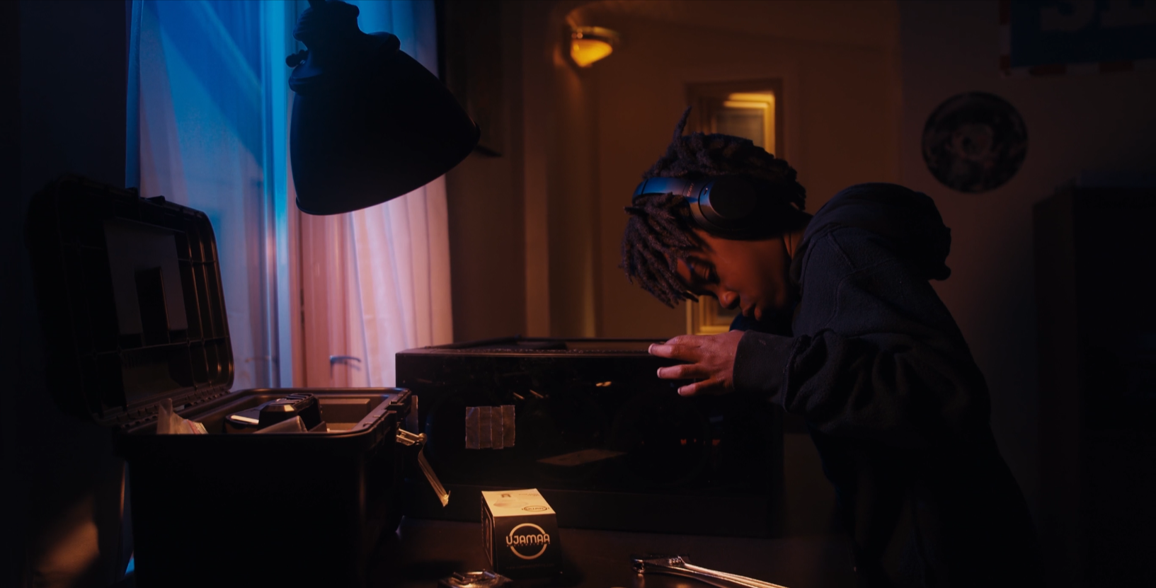 A cinematic frame from ShowBlackss’ Ujamaa Lighting work