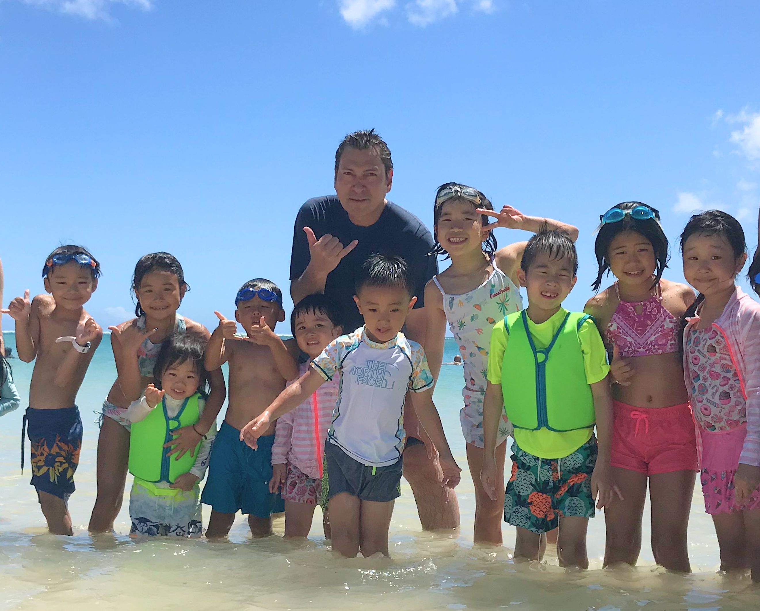 Jerry with Joy students in the shallow waters of Hawaii