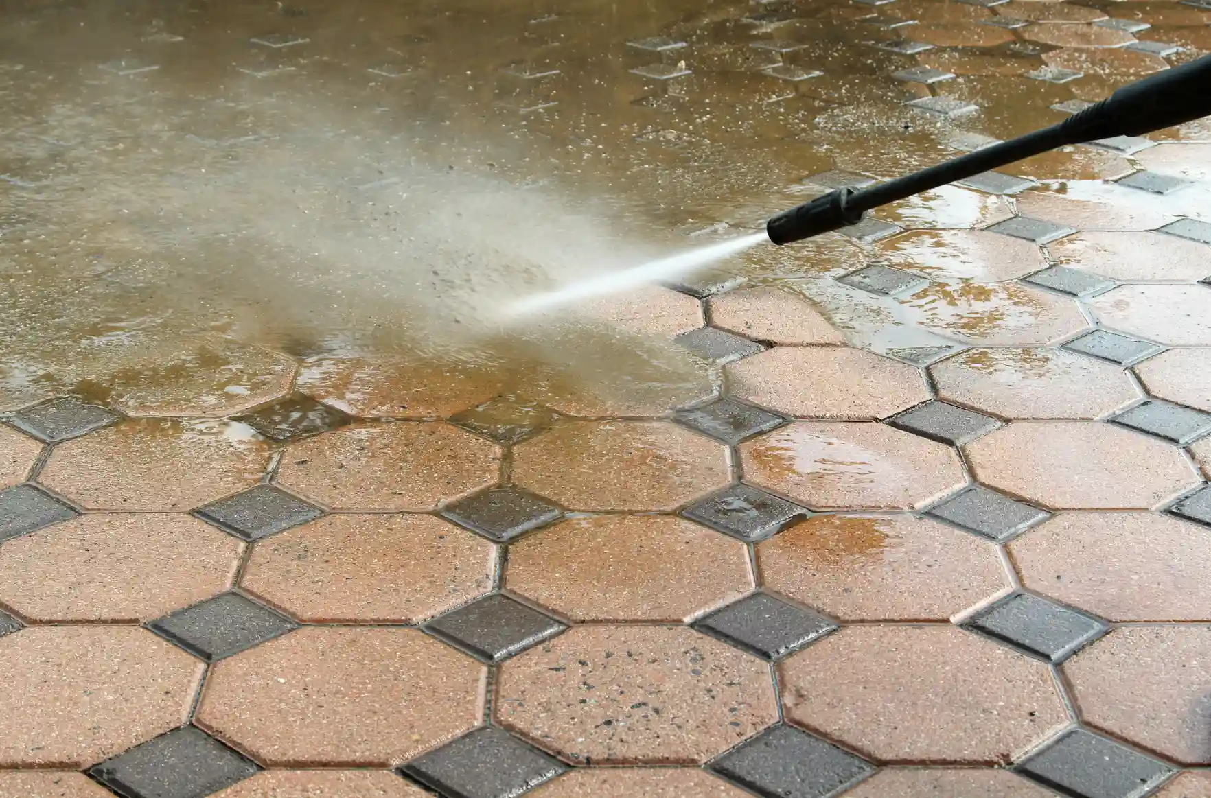 Power washing on exterior tile surface