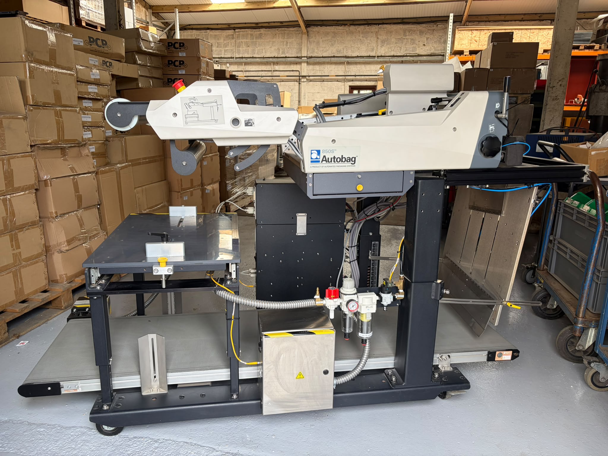 Pre-owned Autobag 850S automatic bagging system with takeaway conveyor