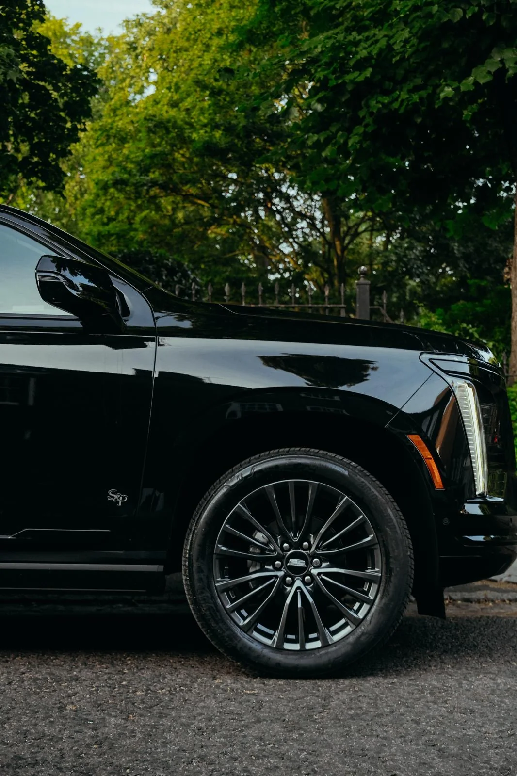 Close detail of the black Veloria chauffeur vehicle wheel