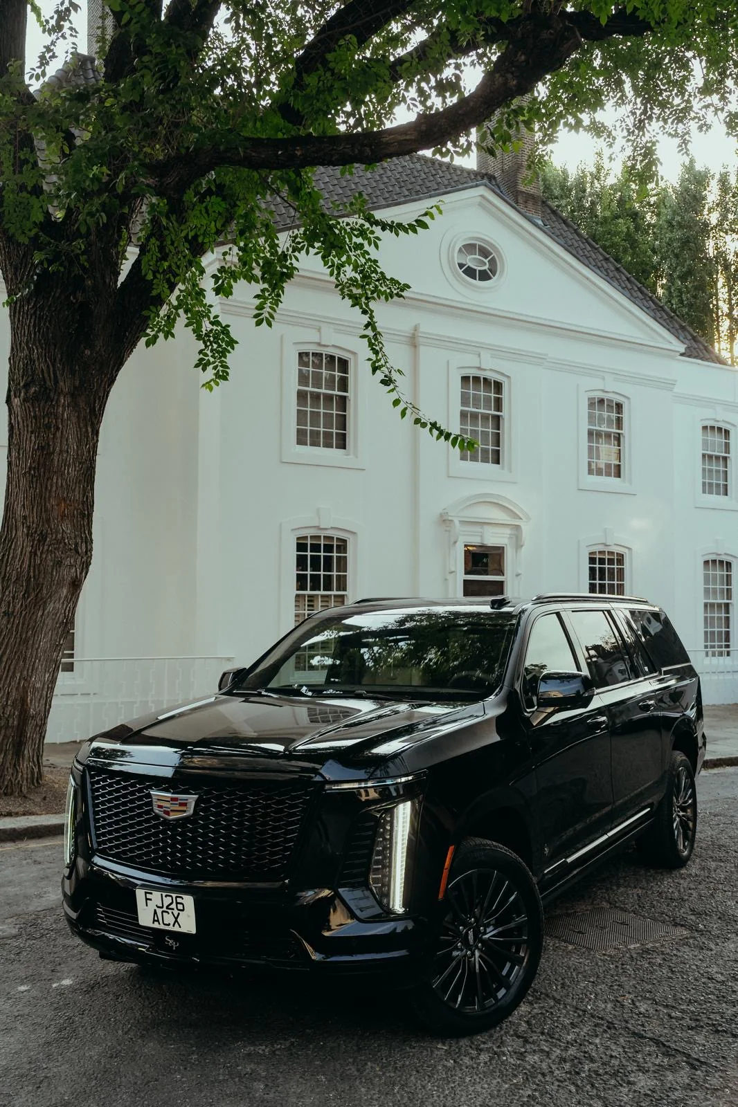 Black Veloria chauffeur vehicle photographed from the front at a venue