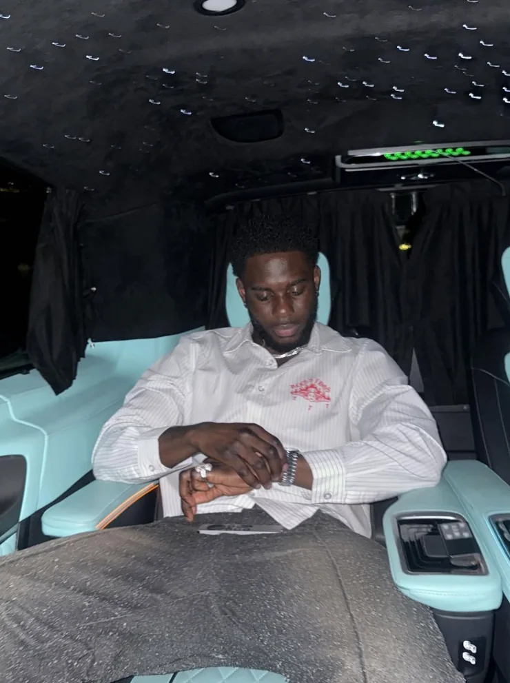 Guest checking watch inside chauffeur cabin