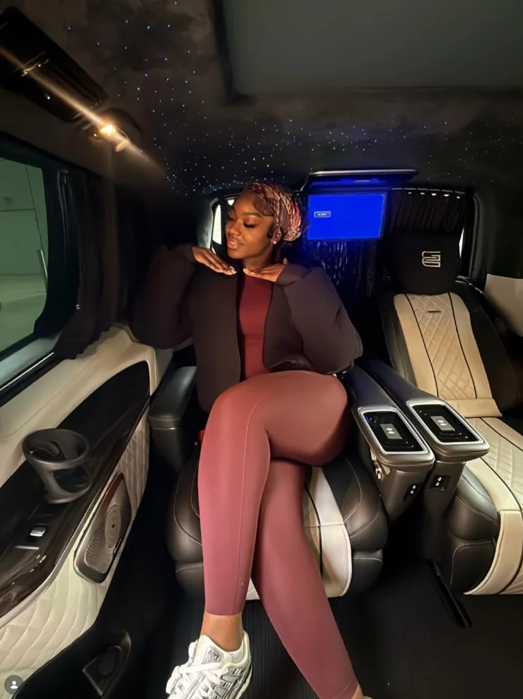 Guest posing inside a premium car cabin
