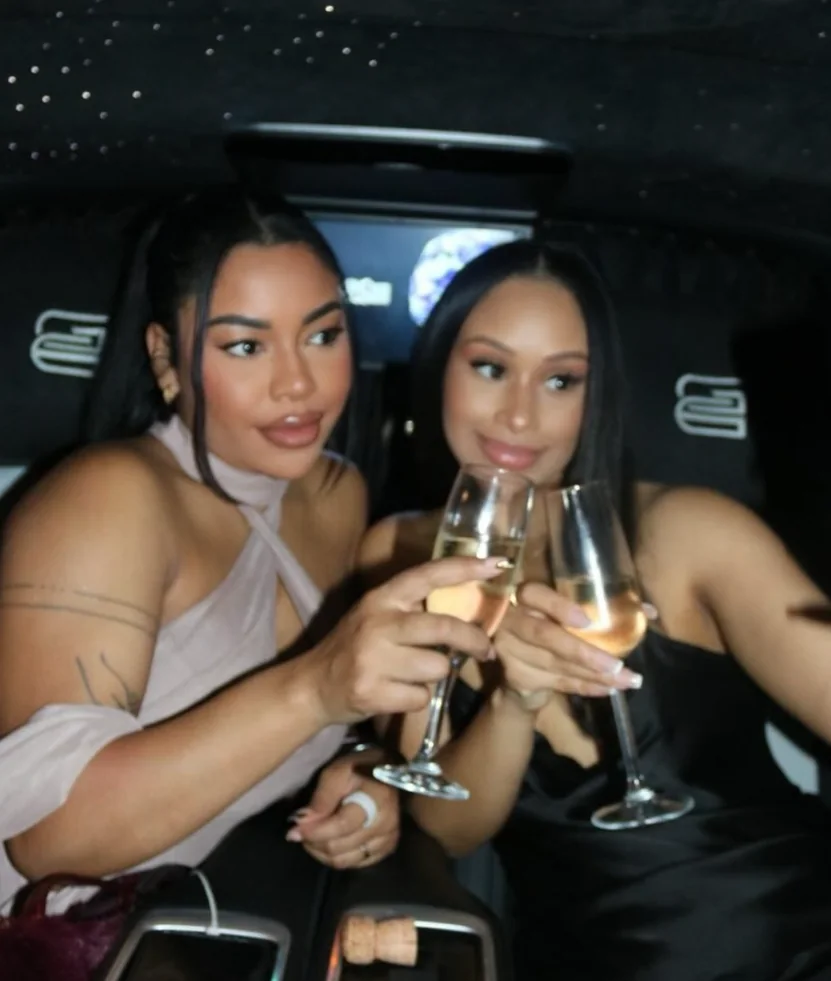 Guests with drinks inside a chauffeur cabin