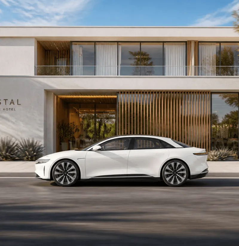 Lucid Air waiting outside a hotel entrance