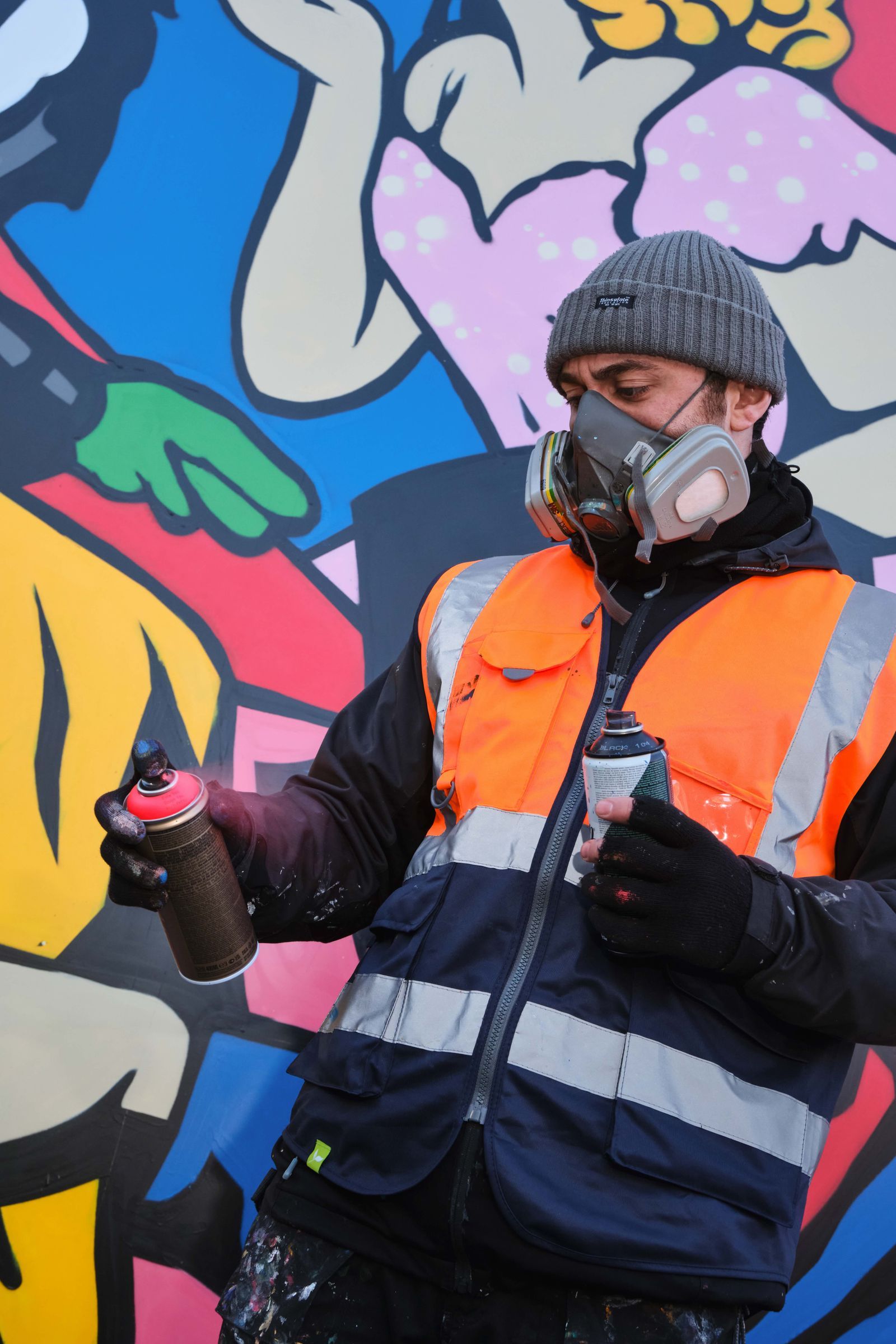 Artist at work on a commissioned mural