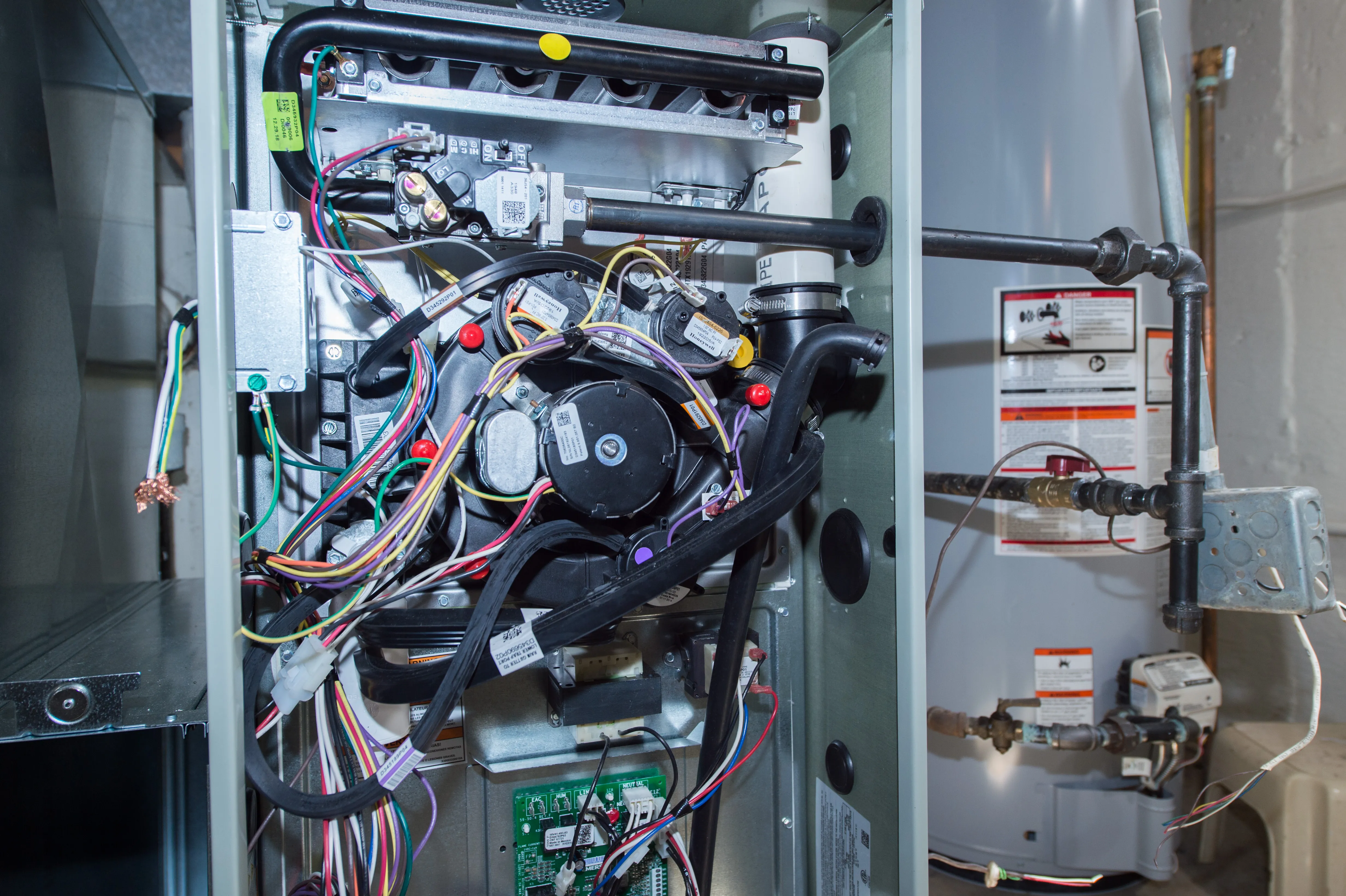 Technician cleaning burners and ignition components