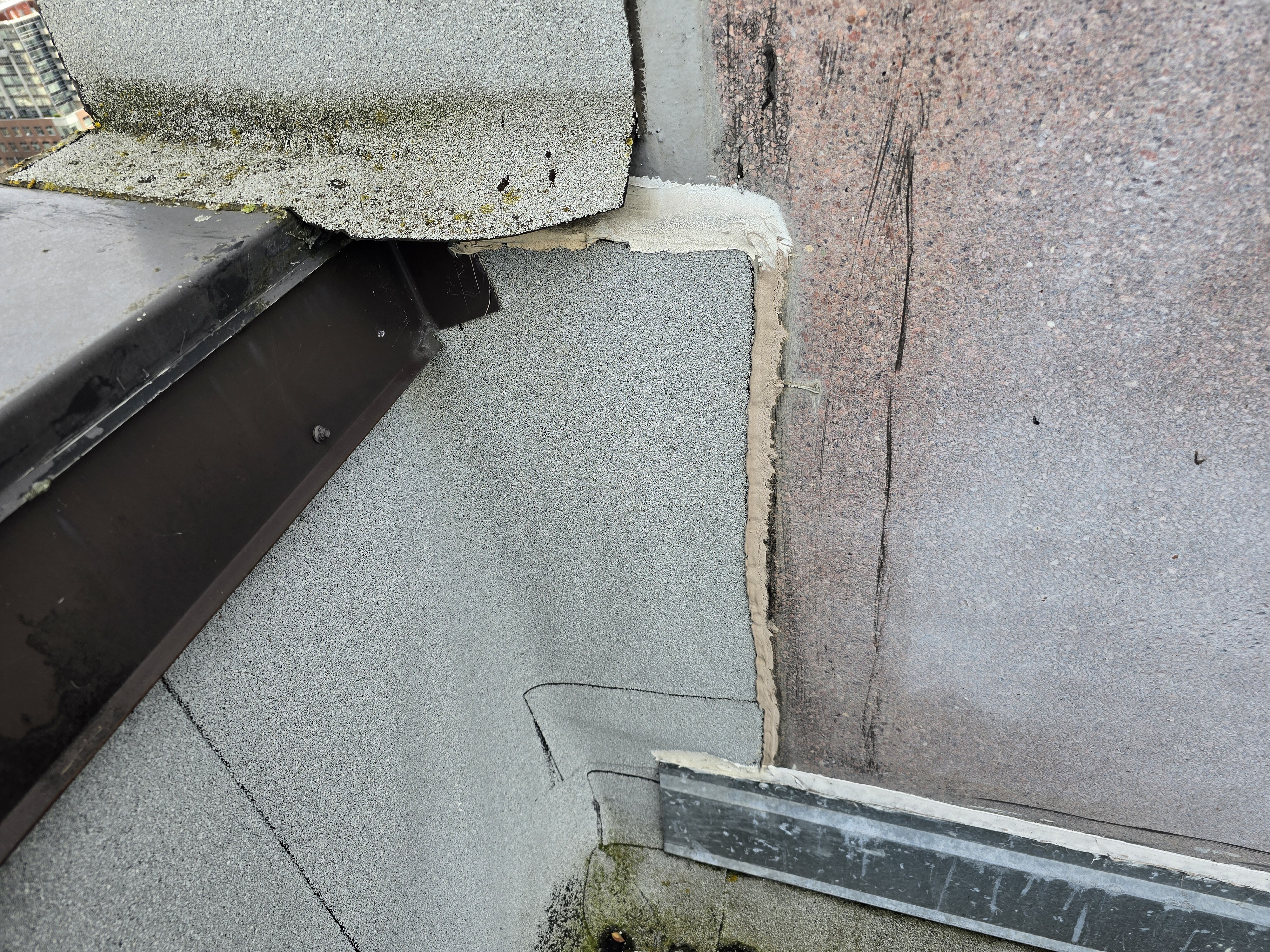 Flat roof leak investigation tracing water from a rooftop detail to an interior ceiling stain
