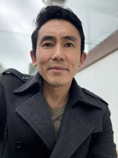 Benn Lim, certified Scaling Up coach, smiling outdoors