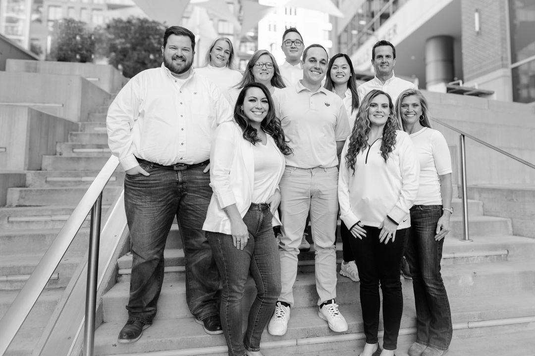 The Vero team together outside the office