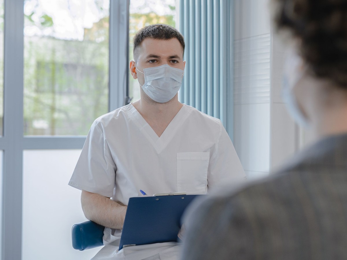 Medical consultation, taking notes, soft light