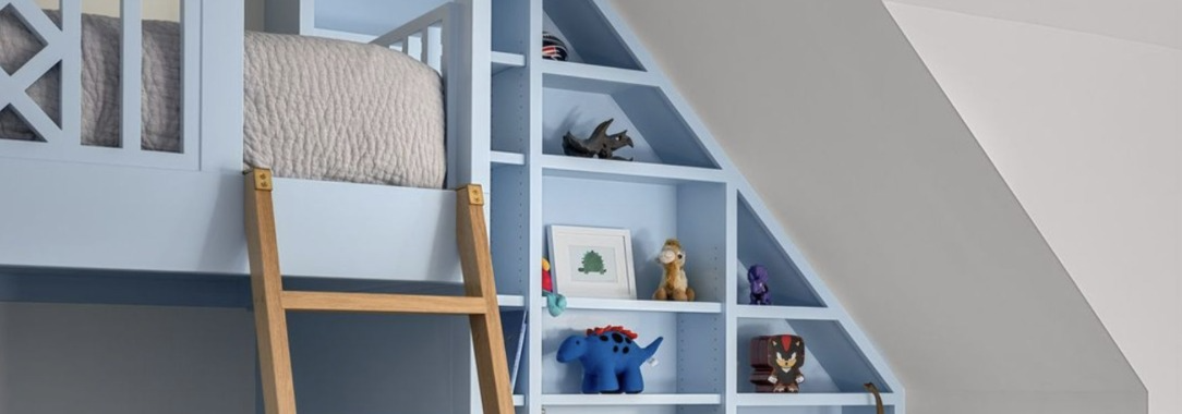 Blue painted built-in bunk room with shelving