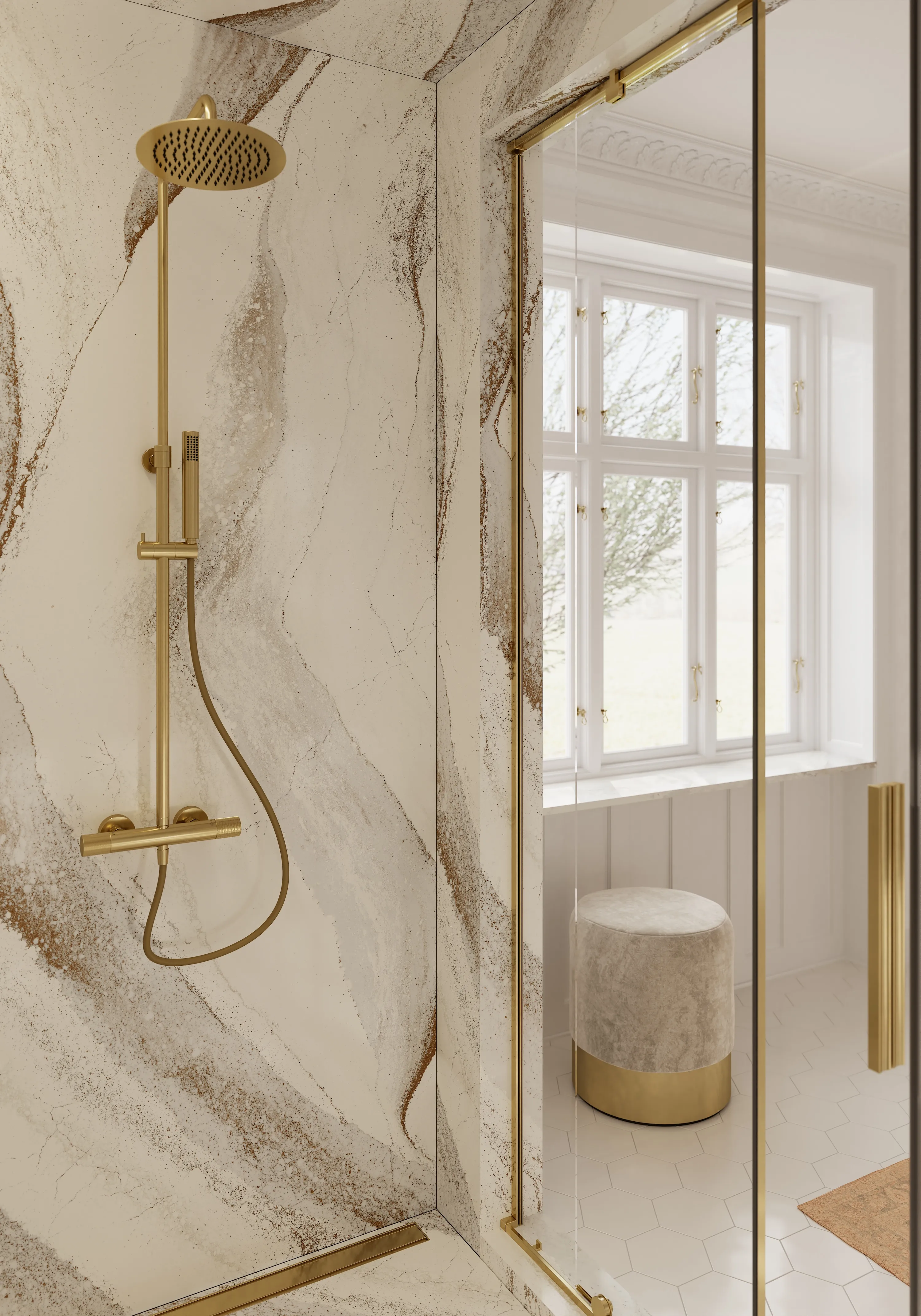 Glass-enclosed shower with cream veined walls, brass fixtures, and a brass door handle