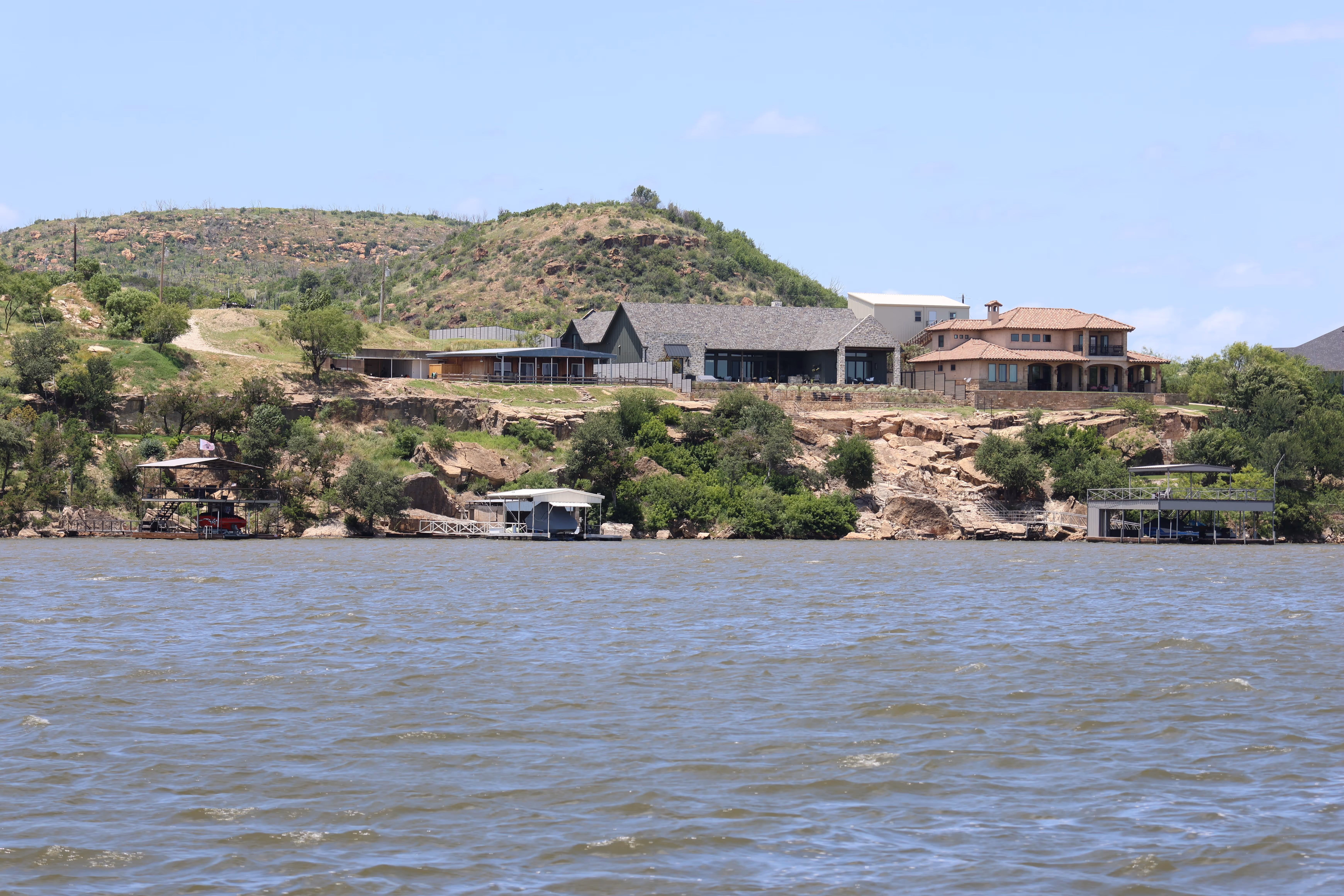 Homes on the hillside above Possum Kingdom Lake with private boat docks